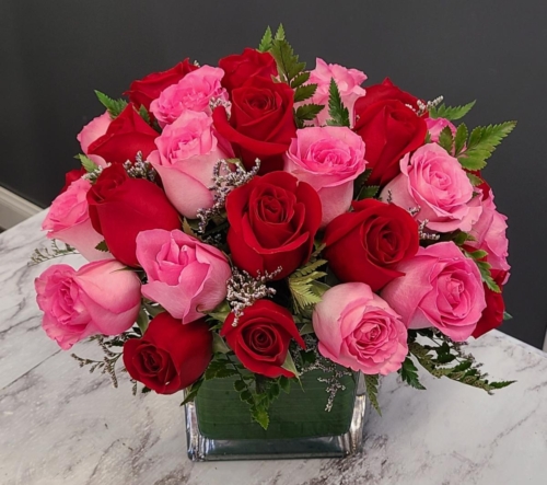 One Dozen Pink, One Dozen Red Arranged in a Square Glass Cube. $199.99