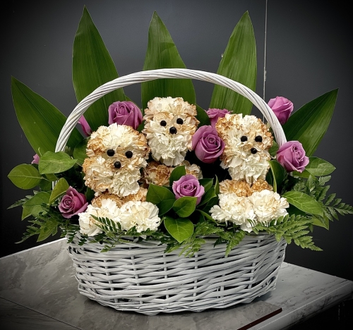 Large Basket with 3 dogs created from fresh flowers.